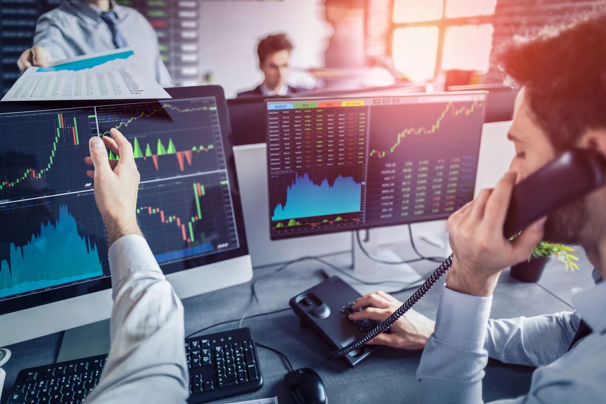 Investment professionals analyzing market data